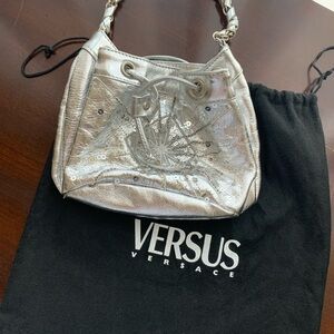 Small silver leather Versace purse.